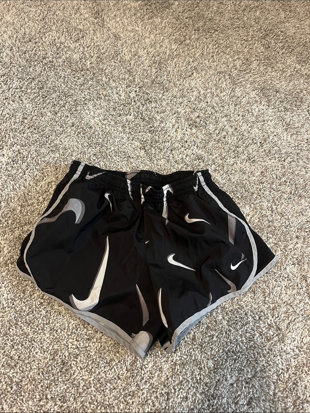 Nike Black Women’s Athletic Shorts with Gray Swoosh Pattern